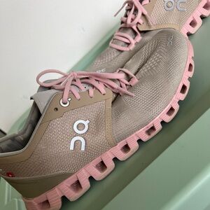 On Running Tan and Pink Athletic Shoes with Cloud Cushioning